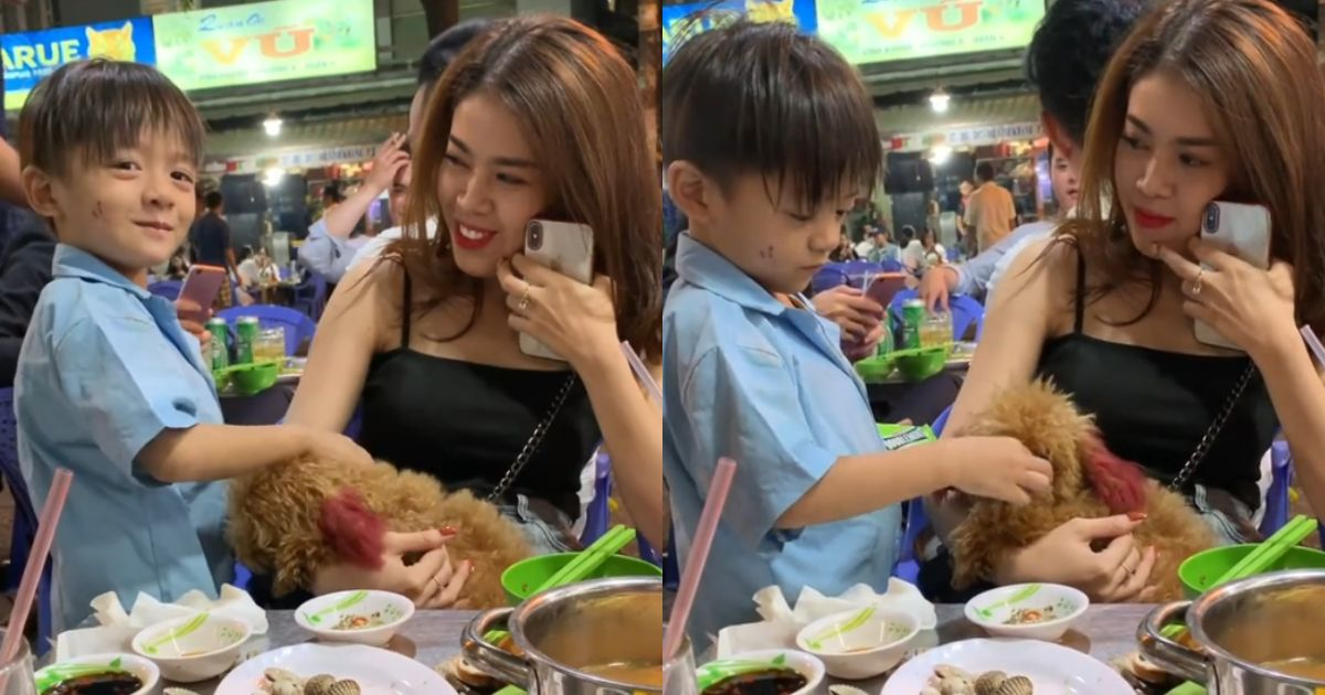 Khoảnh khắc bé trai bán hàng rong ôm thú cưng khiến netizen xúc động, "triệu like" vì hành động của chủ chó