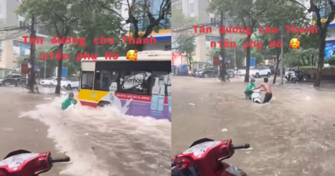 Cảm động: Anh phụ hồ bất chấp mưa to, nước ngập đến nửa người lao ra cứu nguy cho xe máy bị ngã